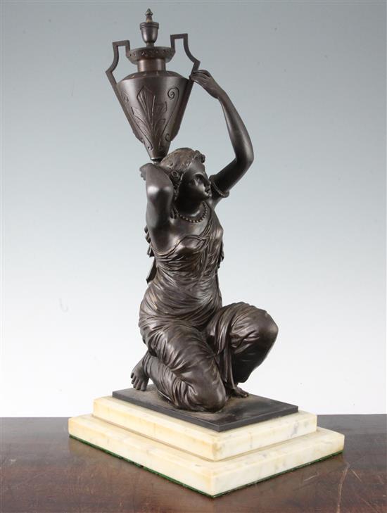 A Victorian patinated bronze figure of an eastern water carrier 18.5in.